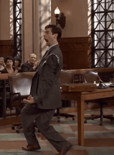 Man In Suit Dancing In Courtroom GIF