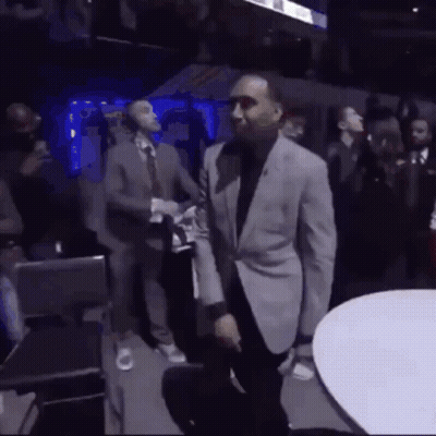 Man In Suit Dancing In Crowded Room GIF