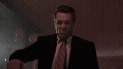 Man In Suit Dancing In Dark Club GIF
