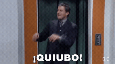 Man In Suit Dancing In Elevator Saying Quiubo GIF