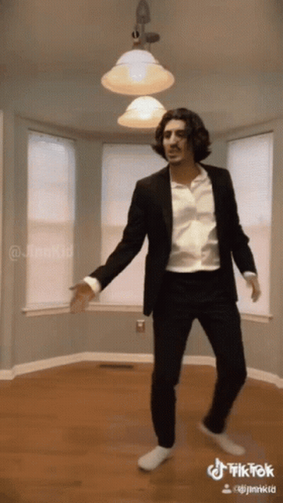 Man In Suit Dancing In Empty Room TikTok GIF