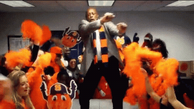 Man In Suit Dancing In Front Of Cheerleaders GIF