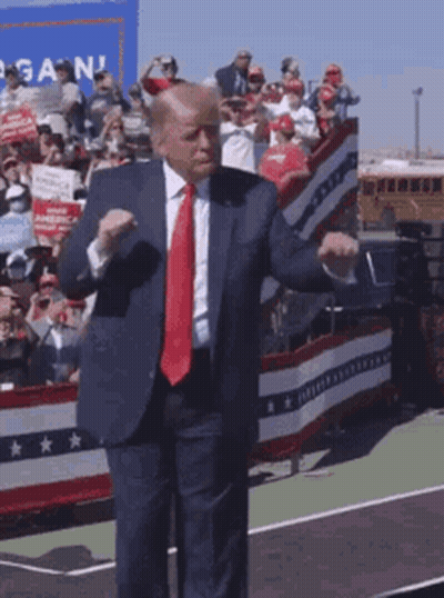 Man In Suit Dancing In Front Of Crowd GIF