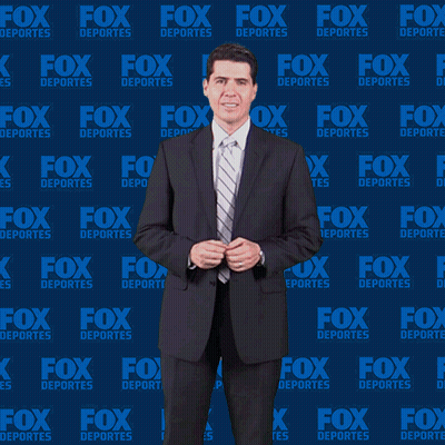Man In Suit Dancing In Front Of Fox Deportes Wall GIF
