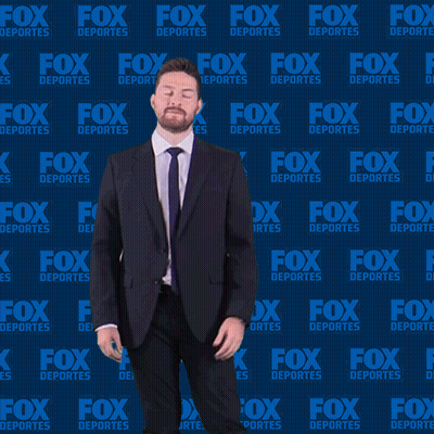 Man In Suit Dancing In Front Of Fox Deportes Wall GIF