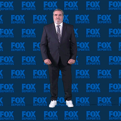 Man In Suit Dancing In Front Of Fox Deportes Wall GIF