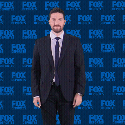 Man In Suit Dancing In Front Of Fox Deportes Wall GIF