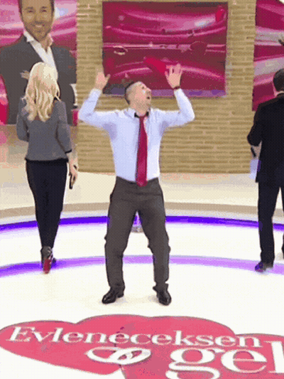Man In Suit Dancing In Front Of Heart Saying Evleneceksen Gel GIF
