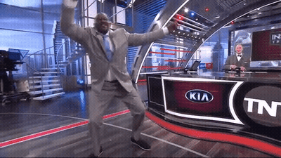 Man in Suit Dancing in Front of Kia Logo