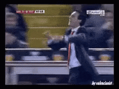 Man In Suit Dancing In Front Of TV Saying NFC GIF