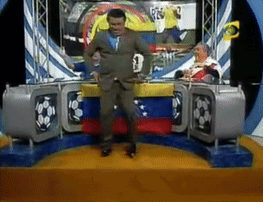 Man In Suit Dancing In Front Of TV With Number 3 GIF