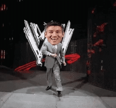 Man In Suit Dancing In Front Of W Logo GIF