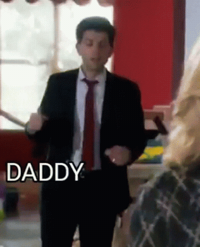 Man In Suit Dancing In Front Of Woman Saying Daddy GIF