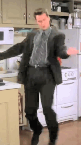 Man In Suit Dancing In Kitchen GIF