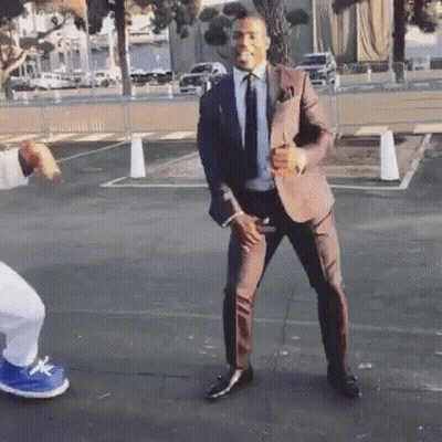 Man In Suit Dancing In Parking Lot GIF