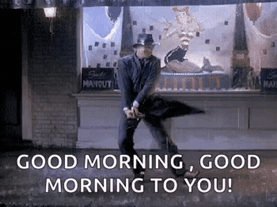 Man In Suit Dancing In Rain With Umbrella GIF