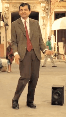 Man In Suit Dancing In Street GIF