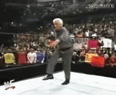 Man In Suit Dancing In Wrestling Ring GIF