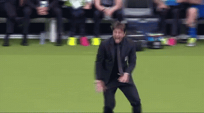 Man In Suit Dancing On Soccer Field GIF