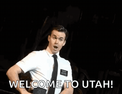 Man In Suit Dancing On Stage Saying Welcome To Utah GIF