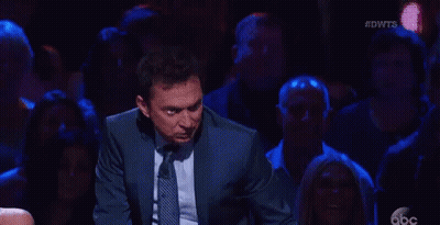 Man In Suit Dancing On Stage GIF