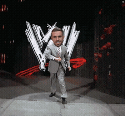 Man In Suit Dancing On Stage With W Logo GIF
