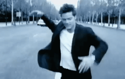 Man In Suit Dancing On Street GIF