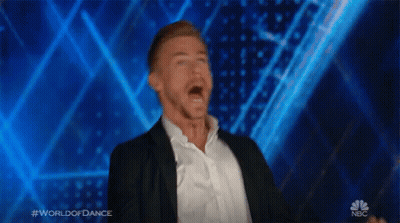 Man In Suit Dancing On World Of Dance Stage GIF