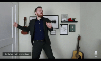 Man In Suit Dancing With Paid Promotion Sign GIF