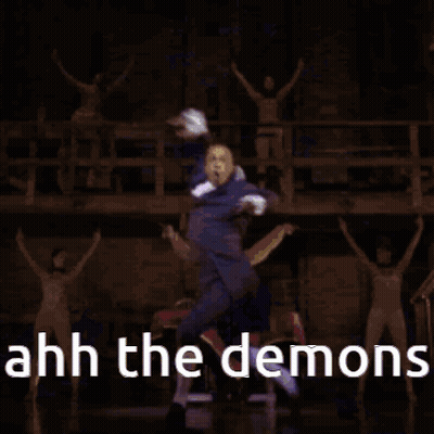Man In Suit Dancing With Sword On Stage GIF