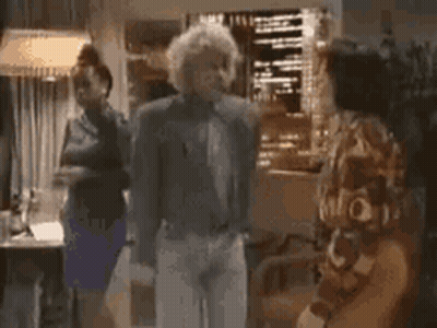 Man In Suit Dancing With Two Women Behind GIF