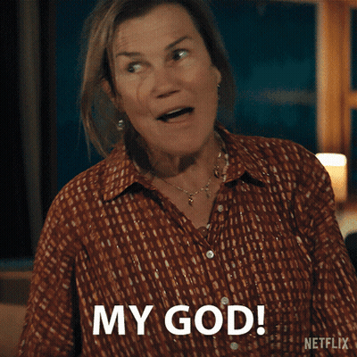 Man In Suit Dancing With Woman In Floral Pants GIF
