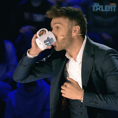Man In Suit Drinking Espana Talent Mug GIF