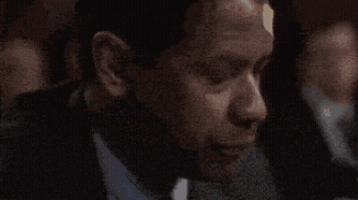 Man In Suit Drinking From Glass Saying God Help Me GIF