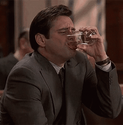 Man In Suit Drinking Glass GIF