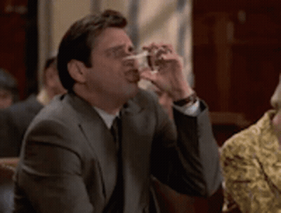 Man In Suit Drinking Glass GIF
