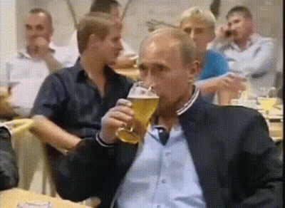 Man In Suit Drinking Glass Of Beer GIF