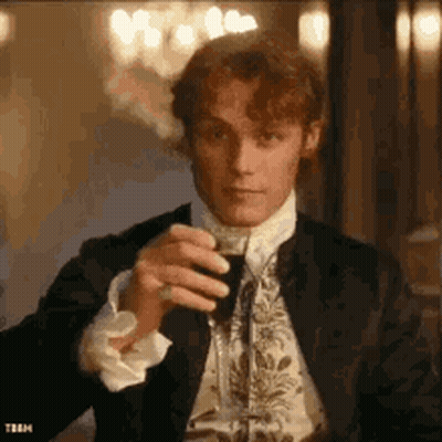 Man In Suit Drinking Glass Of Wine GIF