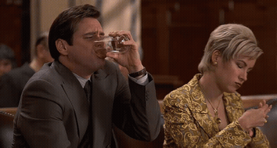 Man In Suit Drinking Glass Woman On Phone GIF