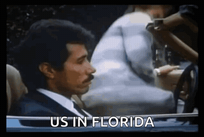 Man In Suit Driving Car Saying Us In Florida GIF
