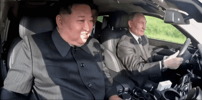 Man In Suit Driving Car With Another Man GIF