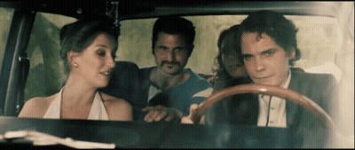 Man In Suit Driving Car With Woman In Back Seat GIF