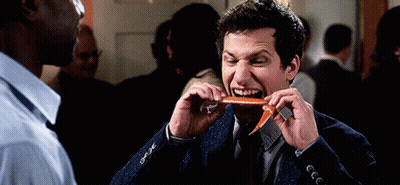 Man In Suit Eating Carrot GIF
