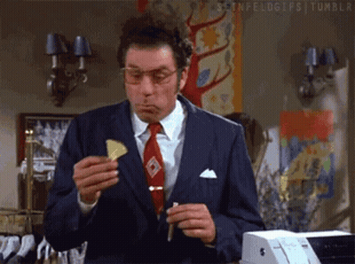Man In Suit Eating Chip GIF
