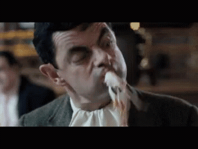 Man In Suit Eating Food GIF