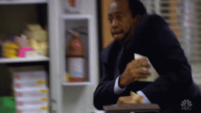 Man In Suit Eating Sandwich GIF
