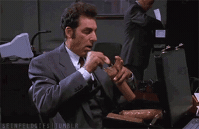 Man In Suit Eating Sausages From Briefcase GIF