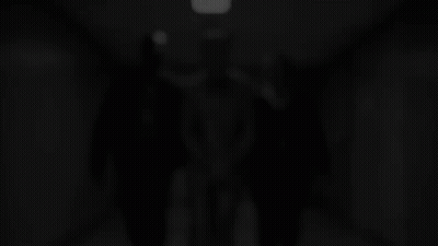 Man In Suit Escorted By Two Police Officers GIF