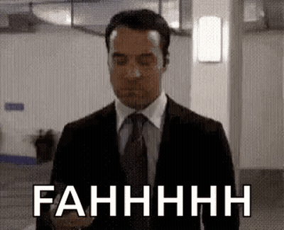 Man In Suit Eyes Closed Saying Fahhhh GIF