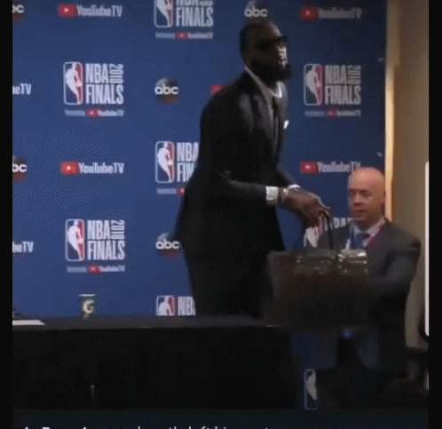 Man In Suit Facing NBA Finals Wall GIF